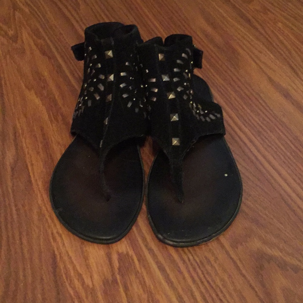 Black gladiator thong sandal w/ gold embellishment